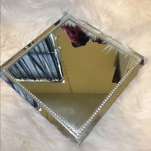 small mirror to place perfumes.